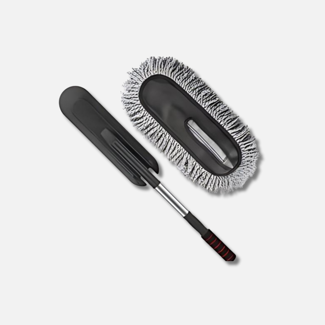 a mop and a cleaning brush on a white background